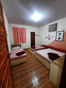 מיטה או מיטות בחדר ב-casa praia de guajiru