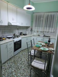 A kitchen or kitchenette at "Vasiliki" Home