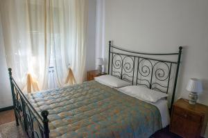 a bedroom with a bed and a window at B&B Da Beppe in Neirone