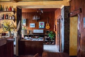 a home office with a desk and a guitar at B&B Da Beppe in Neirone +5 photos