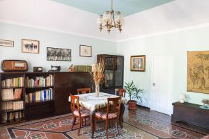 a dining room with a table and chairs at B&B Da Beppe in Neirone