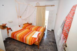 a bedroom with two beds and a window at Miranda Haus in Arillas