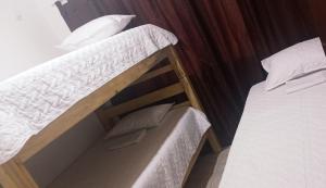a couple of bunk beds in a room at Enjoy Colombia Hostel in Villavicencio
