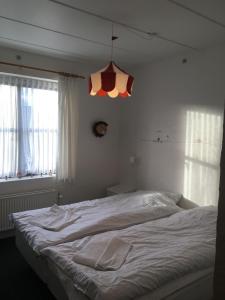 Voodi või voodid majutusasutuse Roslev Hus toas
