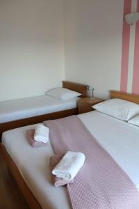Postel nebo postele na pokoji v ubytování Apartments Renata