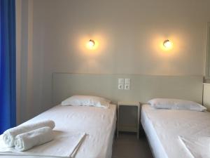 Postel nebo postele na pokoji v ubytování Seaside Apartments Flogita