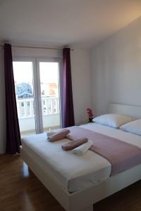 Postel nebo postele na pokoji v ubytování Apartments Renata