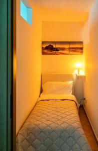 Letto o letti in una camera di Casa Vacanze A' Lanterna