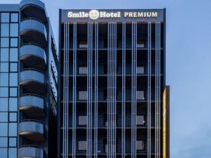 a building with a sign on the side of it at Smile Hotel Premium Hakodate Goryokaku in Hakodate