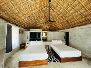 Postel nebo postele na pokoji v ubytování Maya Tulum By G Hotels