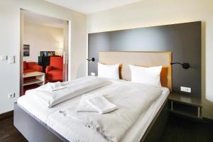 Postel nebo postele na pokoji v ubytování Resort Deichgraf Resort Deichgraf 27-15