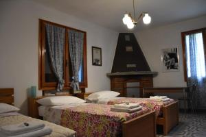 A bed or beds in a room at Appartamento Degli Dei (Affittacamere)