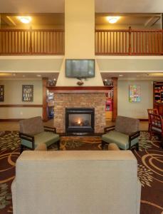 a living room filled with furniture and a fire place at Sonesta ES Suites Anaheim Resort Area in Anaheim