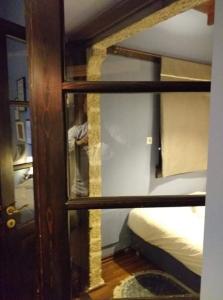 a room with two bunk beds and a mirror at Soul boutique hotel in Monodendri