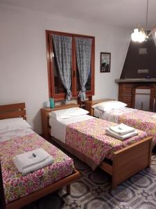 A bed or beds in a room at Appartamento Degli Dei (Affittacamere)