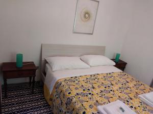 A bed or beds in a room at Appartamento Degli Dei (Affittacamere)
