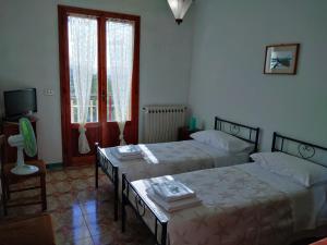 A bed or beds in a room at Appartamento Degli Dei (Affittacamere)