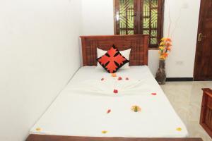 Rúm í herbergi á Sigiriya Hillside View Villa