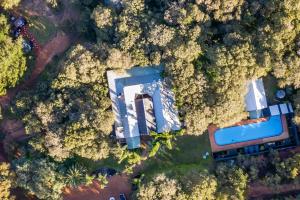 an overhead view of two buildings in the forest at Yallingup Lodge Spa Retreat in Yallingup