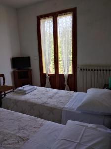 A bed or beds in a room at Appartamento Degli Dei (Affittacamere)