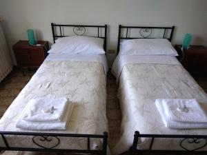 A bed or beds in a room at Appartamento Degli Dei (Affittacamere)