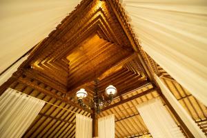 a ceiling of a building with a chandelier at Tanah Damai Hotel in Nusa Penida