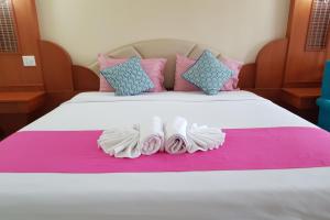 Poonsook Phitsanulok Hotel SHA Plus客房内的一张或多张床位