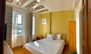 Postel nebo postele na pokoji v ubytování TH Quy Nhơn Hotel + 37 fotografií