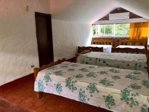 Posteľ alebo postele v izbe v ubytovaní Finca La Dacha