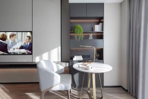 TV a/nebo společenská místnost v ubytování Somerset Daxing Beijing
