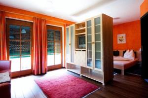 Postel nebo postele na pokoji v ubytování Hotel Garni Winzerhof Hödl