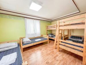 Postel nebo postele na pokoji v ubytování Empathy Guesthouse