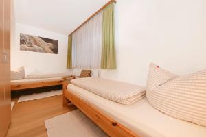 Postel nebo postele na pokoji v ubytování Appartements Künk