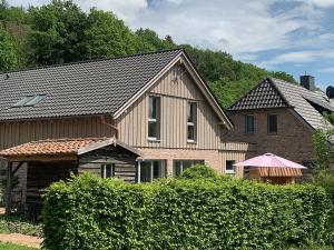 a large house with a house at Donnershag in Sontra