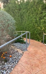 a metal rail next to a walkway at Villa Anna Maria in Coral Bay