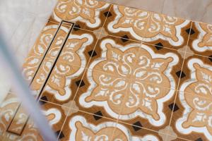 a group of gingerbread cookies on a tiled floor at ARCHONTARIKI Historic Boutique Hotel in Ioannina