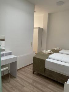 Postel nebo postele na pokoji v ubytování E&B Apartments Korb