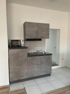 Kuchyň nebo kuchyňský kout v ubytování E&B Apartments Korb