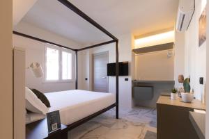 TV a/nebo společenská místnost v ubytování Pietra Bianca Hotel