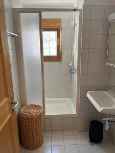 a bathroom with a shower and a sink at Spacious apartment up to 6 people in Flims in Flims