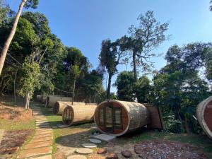 a group of bamboo barrels in a park at The Rock Lodge in Ban Nahin-Nai (1)