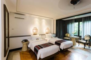 Postel nebo postele na pokoji v ubytování The Henry Resort Dumaguete + 37 fotografií