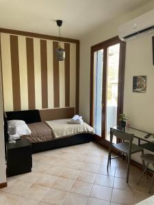 Postel nebo postele na pokoji v ubytování ALBERGO 900Strati