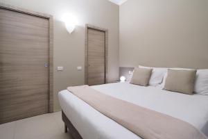 מיטה או מיטות בחדר ב-Contempora Apartments - Cavallotti 13 - B32