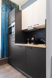 Kuchyň nebo kuchyňský kout v ubytování Riverview Apartments by dasPaul