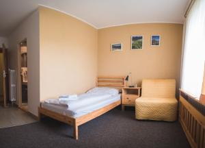 Ένα ή περισσότερα κρεβάτια σε δωμάτιο στο Penzion Zornicka