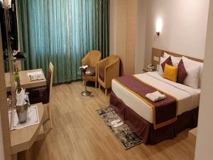 Letto o letti in una camera di IRA By Orchid Bhubaneswar