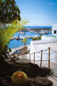 a view of a marina with boats in the water at Casa Eneida frente al mar in Tías