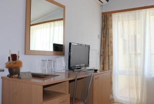 TV a/nebo společenská místnost v ubytování Hotel Radik