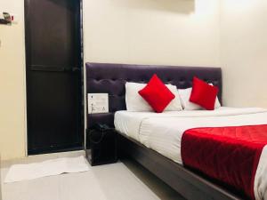 Postel nebo postele na pokoji v ubytování Hotel Guestinn Residency